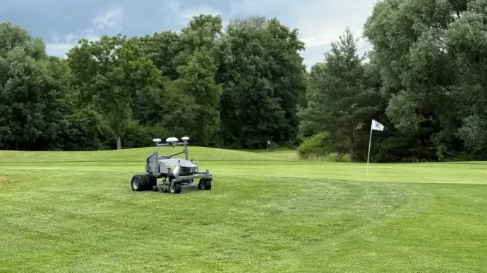 FJD robotic mower on a golf course