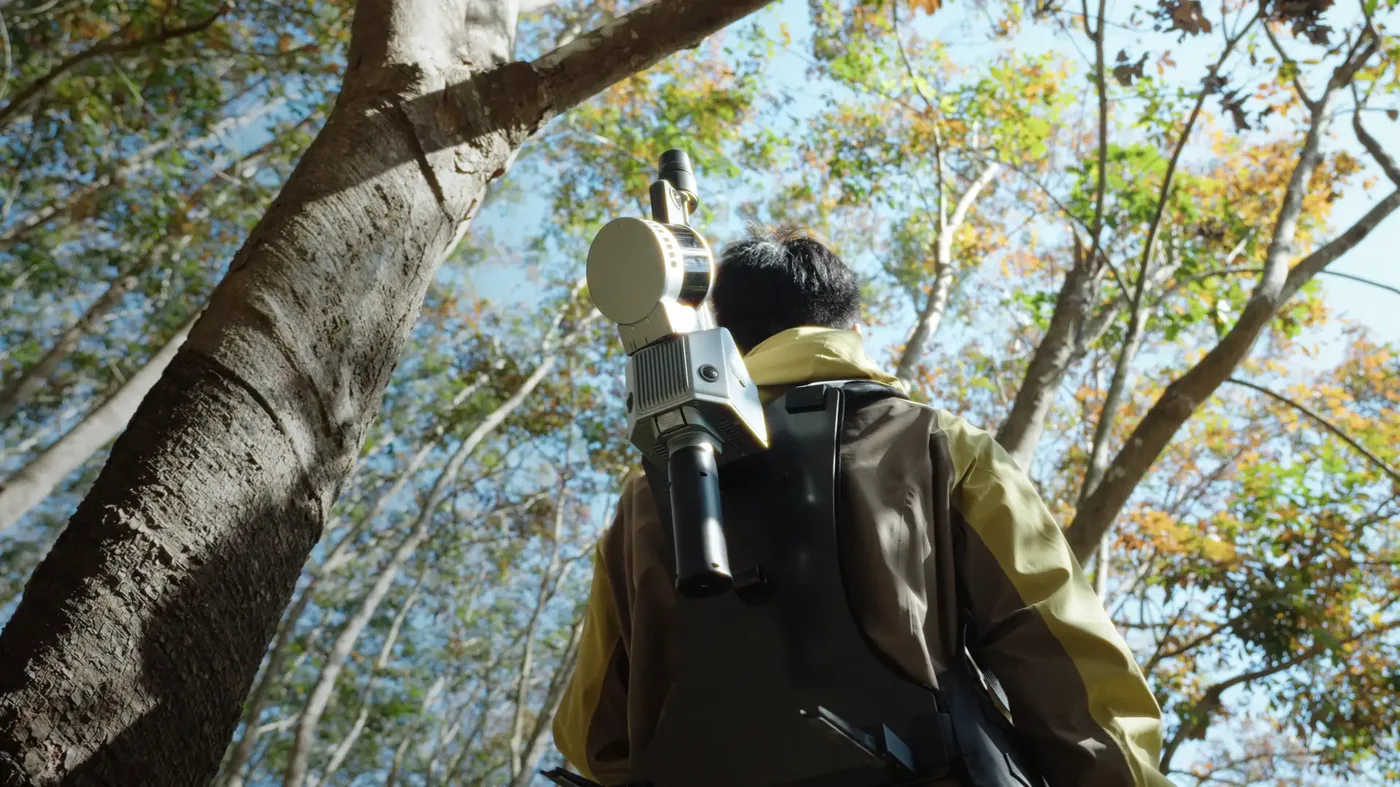 S2 carried in a backpack through a forest