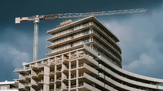 Building under construction with crane
