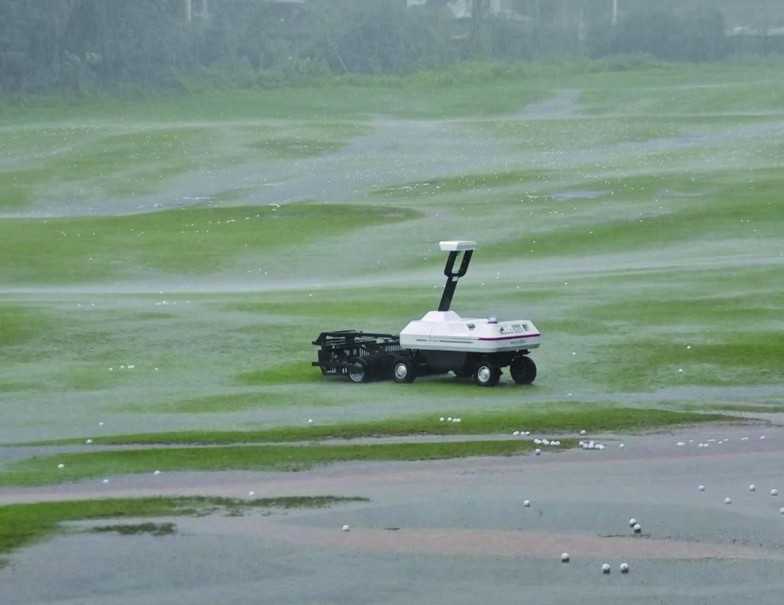 WayPick 2 working on a soaked driving range with standing water on the surface