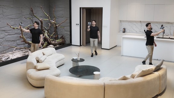 Three people scanning a furniture showroom with FJD Trion C1