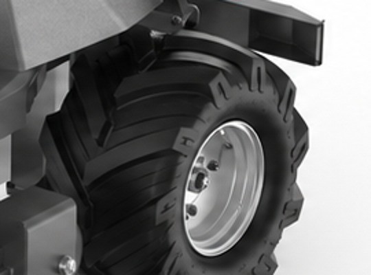 Close-up of FJD XBot and RM21's aggressive herringbone/chevron tread tire